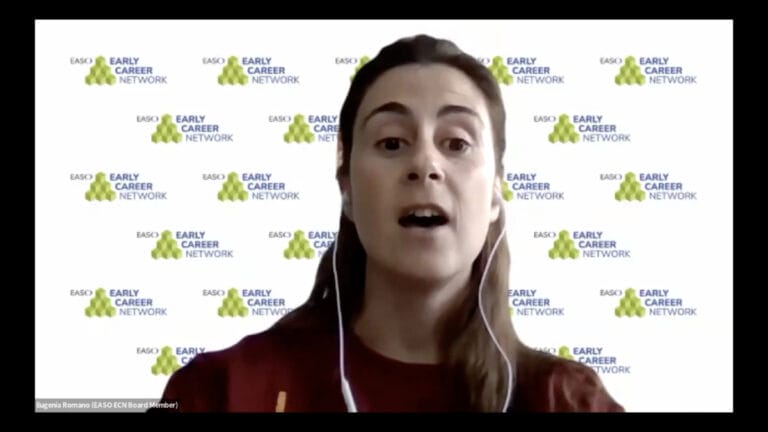 A woman with long brown hair and earphones speaks during a video call. The background displays the "EASD Early Career Network" logo repeatedly.